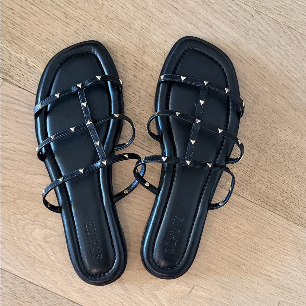 Schutz Black Strappy Sandals with Gold Accents